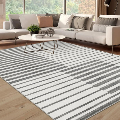 Grey striped short pile rug under a coffee table in a living room