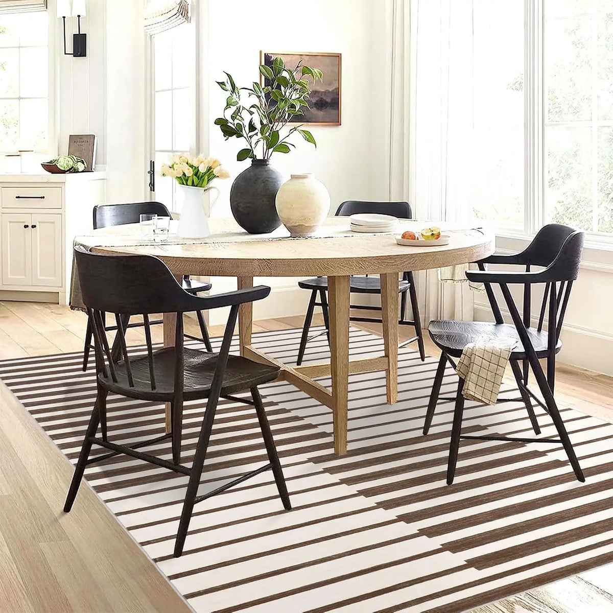 Dark striped short pile rug under a round dining table