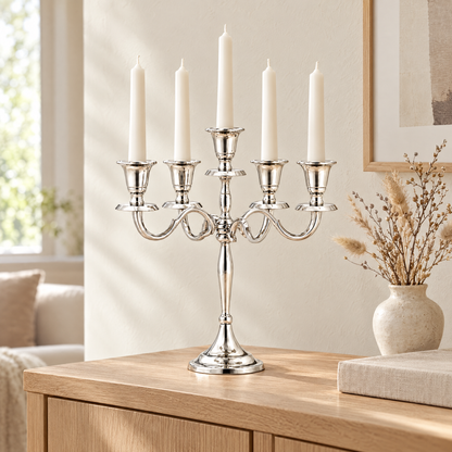 Silver candelabra on an oak sideboard in daylight